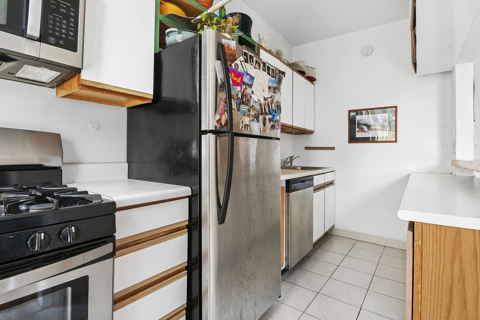 789 A Monroe Street, Unit 2 Brooklyn, NY 11221 - Photo 3 of 8 a kitchen with stainless steel appliances granite countertop a stove and a refrigerator
