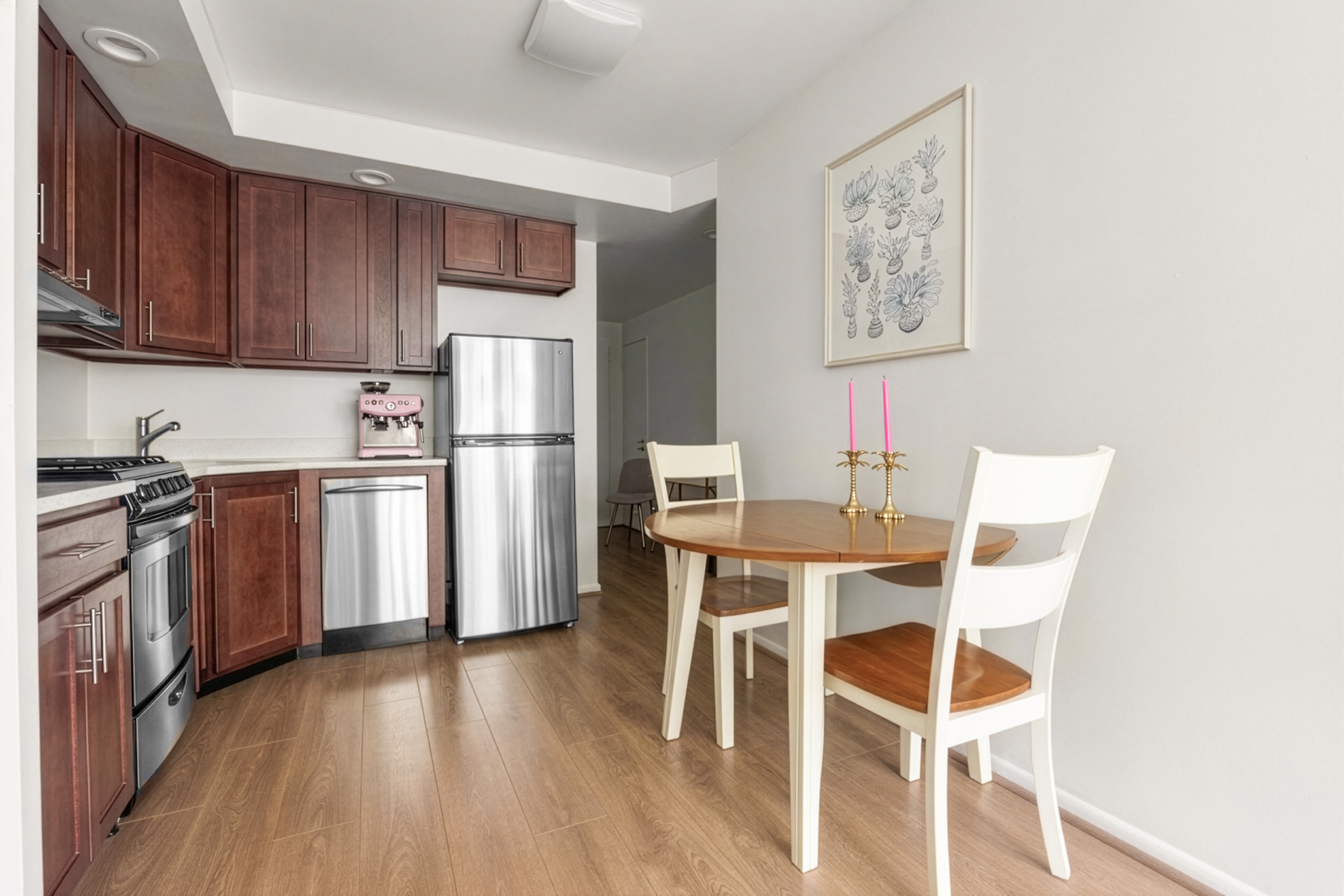 191 Willoughby Street, Unit 5E Brooklyn, NY 11201 - Photo 4 of 16 a kitchen with stainless steel appliances a stove a refrigerator and wooden floors