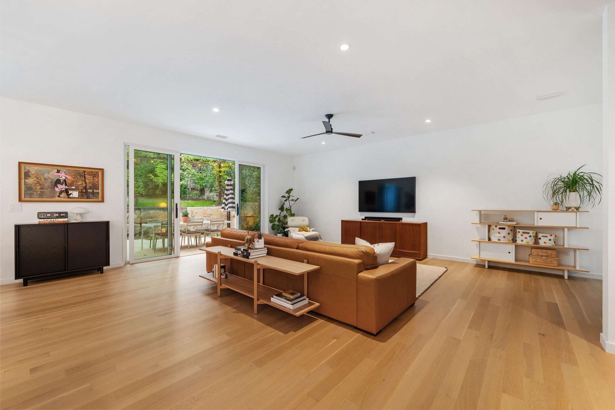 1206 Bickler Road Austin, TX 78704 - Photo 22 of 65 a living room with furniture and a flat screen tv