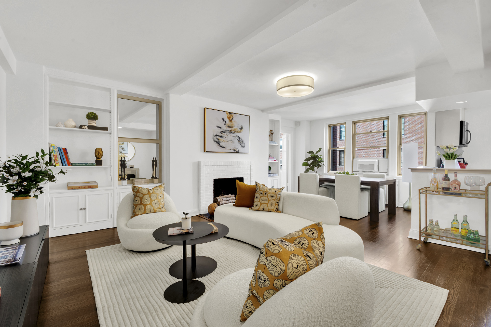 59 West 12th Street, Unit 6A Manhattan, NY 10011 - Photo 3 of 11 a living room with furniture a fireplace and potted plants