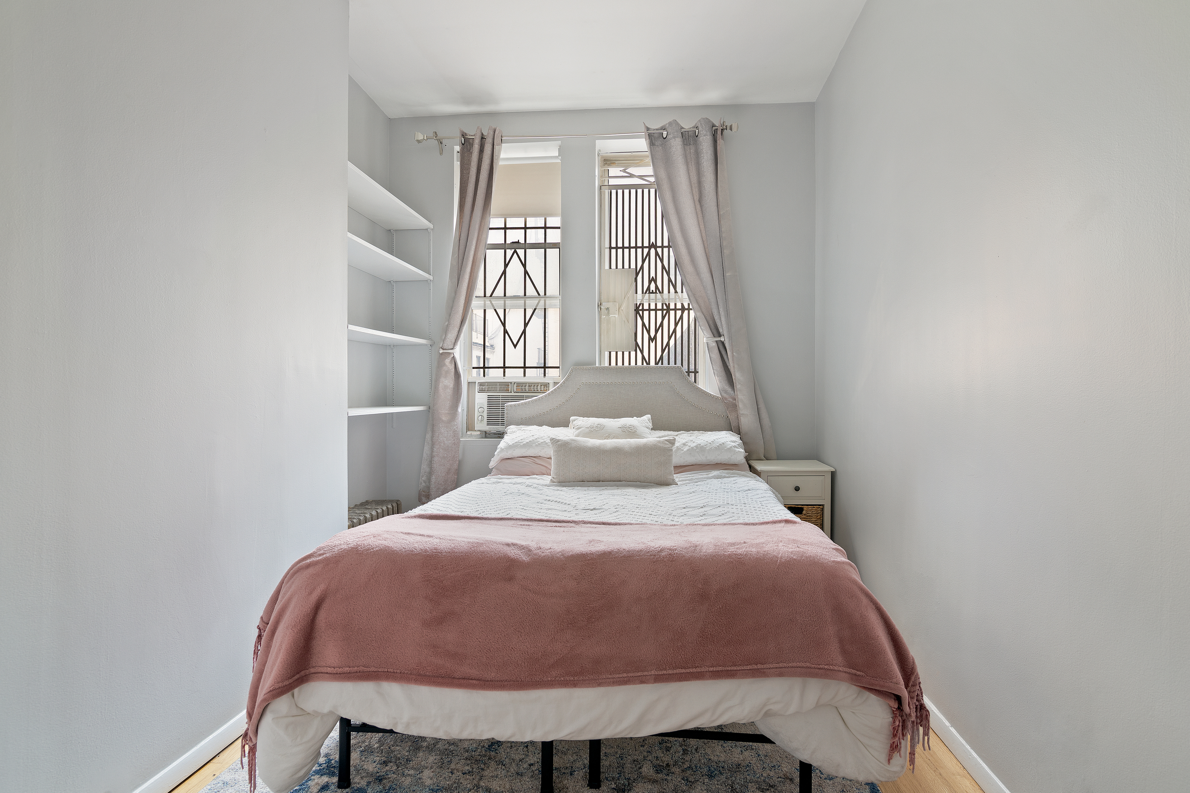 361 3rd Avenue, Unit 1 Manhattan, NY 10016 - Photo 3 of 7 a large bed sitting in a bedroom next to a window
