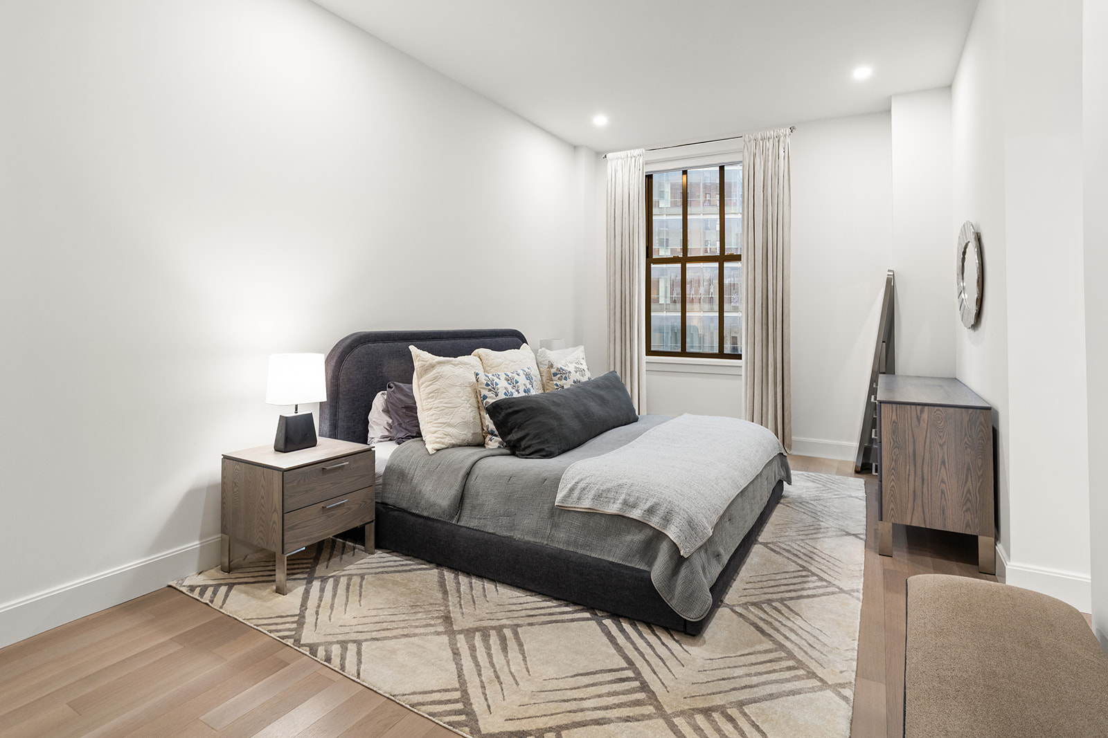 100 Barclay Street, Unit 17J Manhattan, NY 10007 - Photo 4 of 18 a bedroom with a bed and wooden floor
