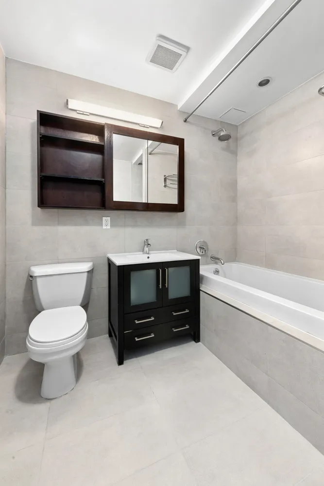 a bathroom with a toilet a sink and a bathtub