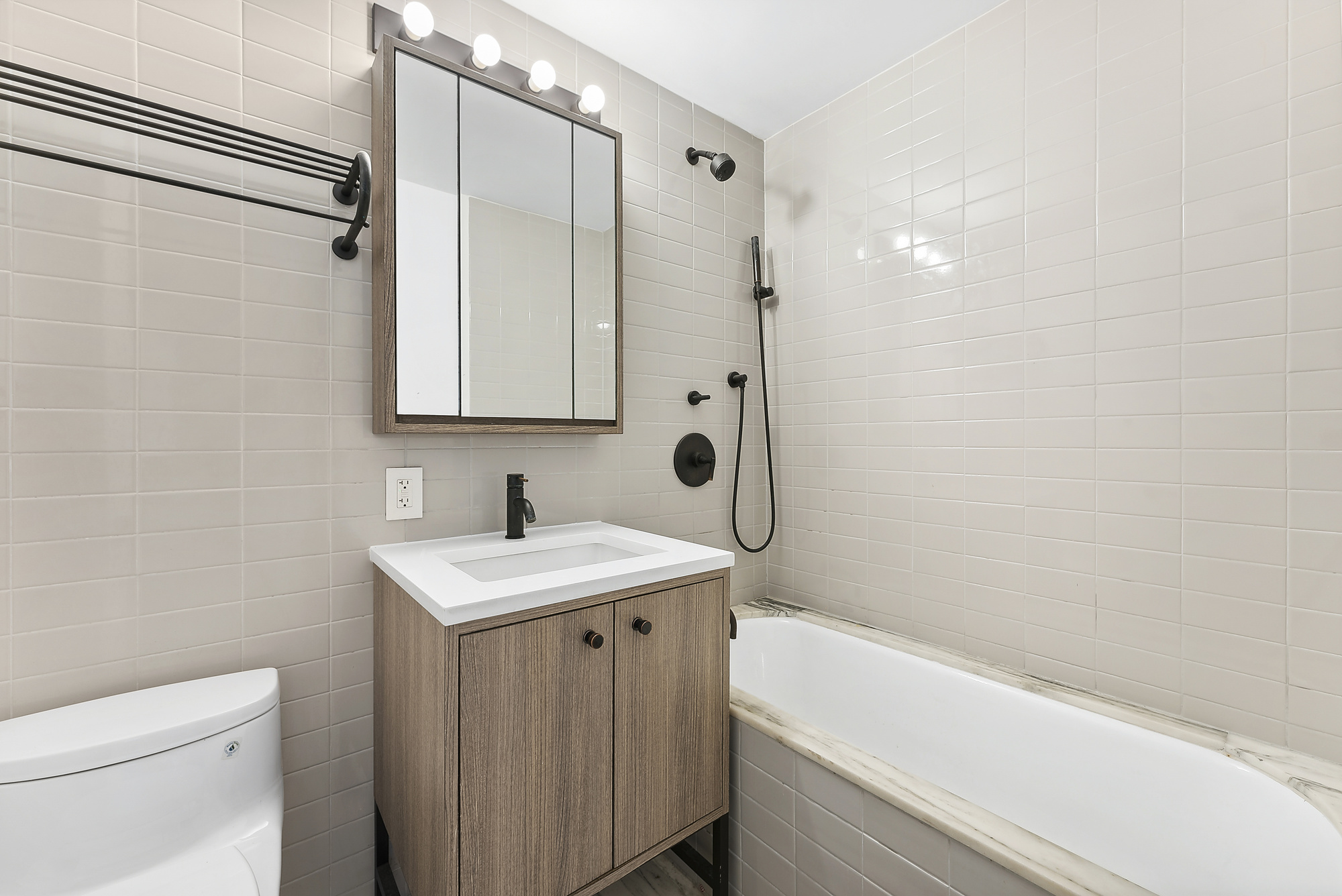 175 West 95th Street, Unit 18G Manhattan, NY 10025 - Photo 5 of 14 a bathroom with a sink a toilet and shower
