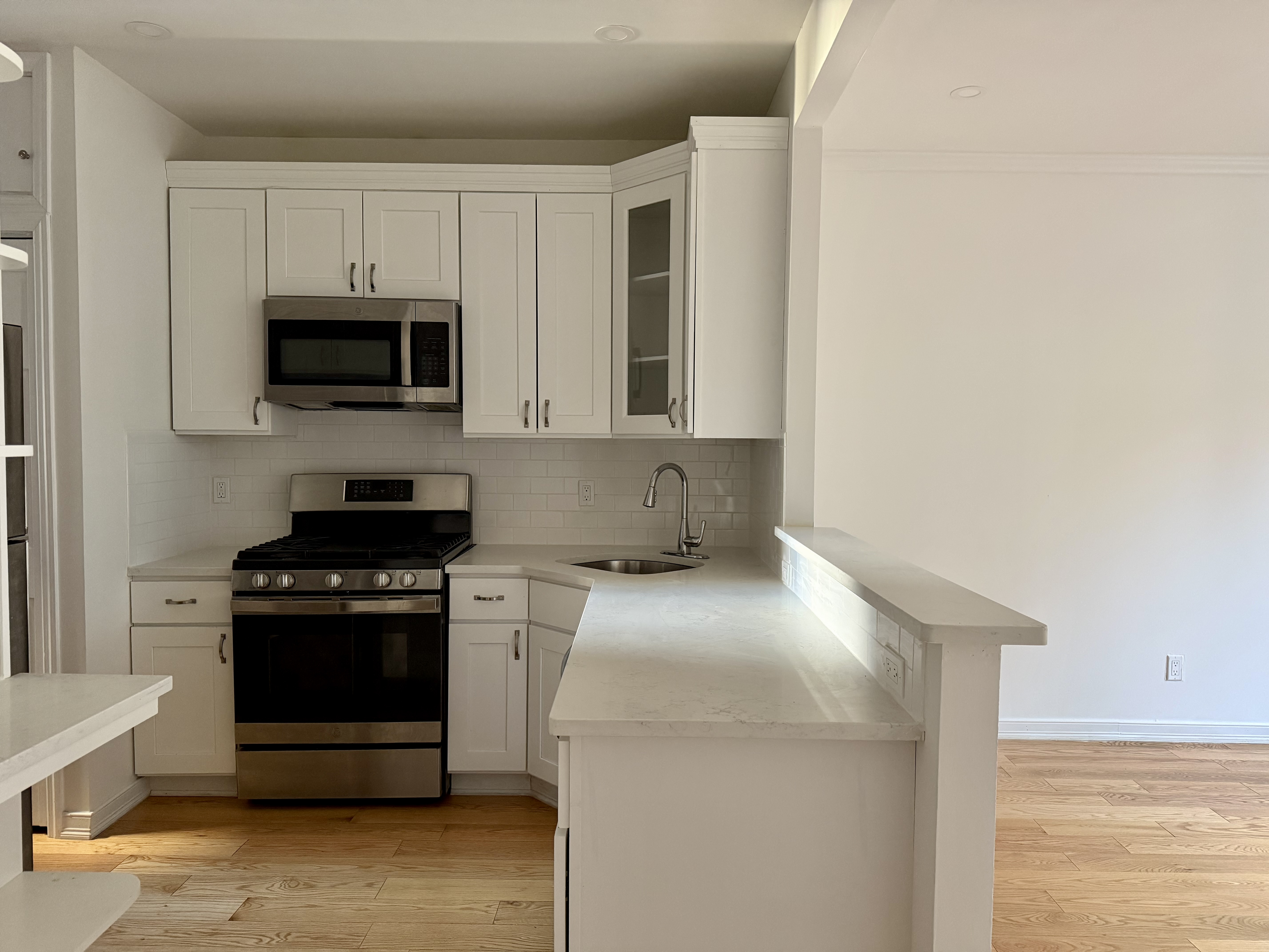 573 6th Street Brooklyn, NY 11215 - Photo 2 of 11 a kitchen with a stove and a microwave