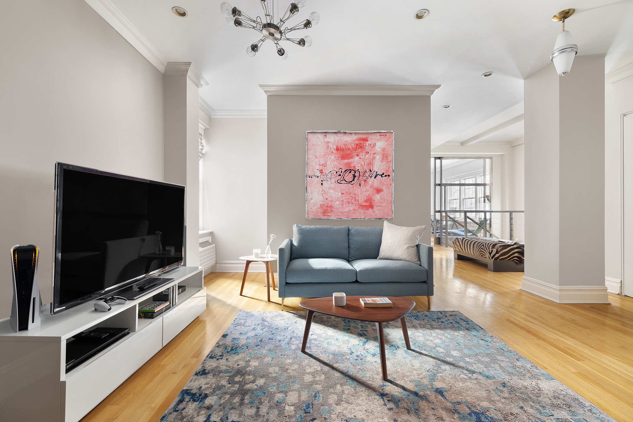 829 Park Avenue, Unit 2D/3D Manhattan, NY 10021 - Photo 10 of 19 a living room with furniture and a flat screen tv