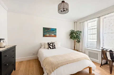 a bedroom with a bed and a table