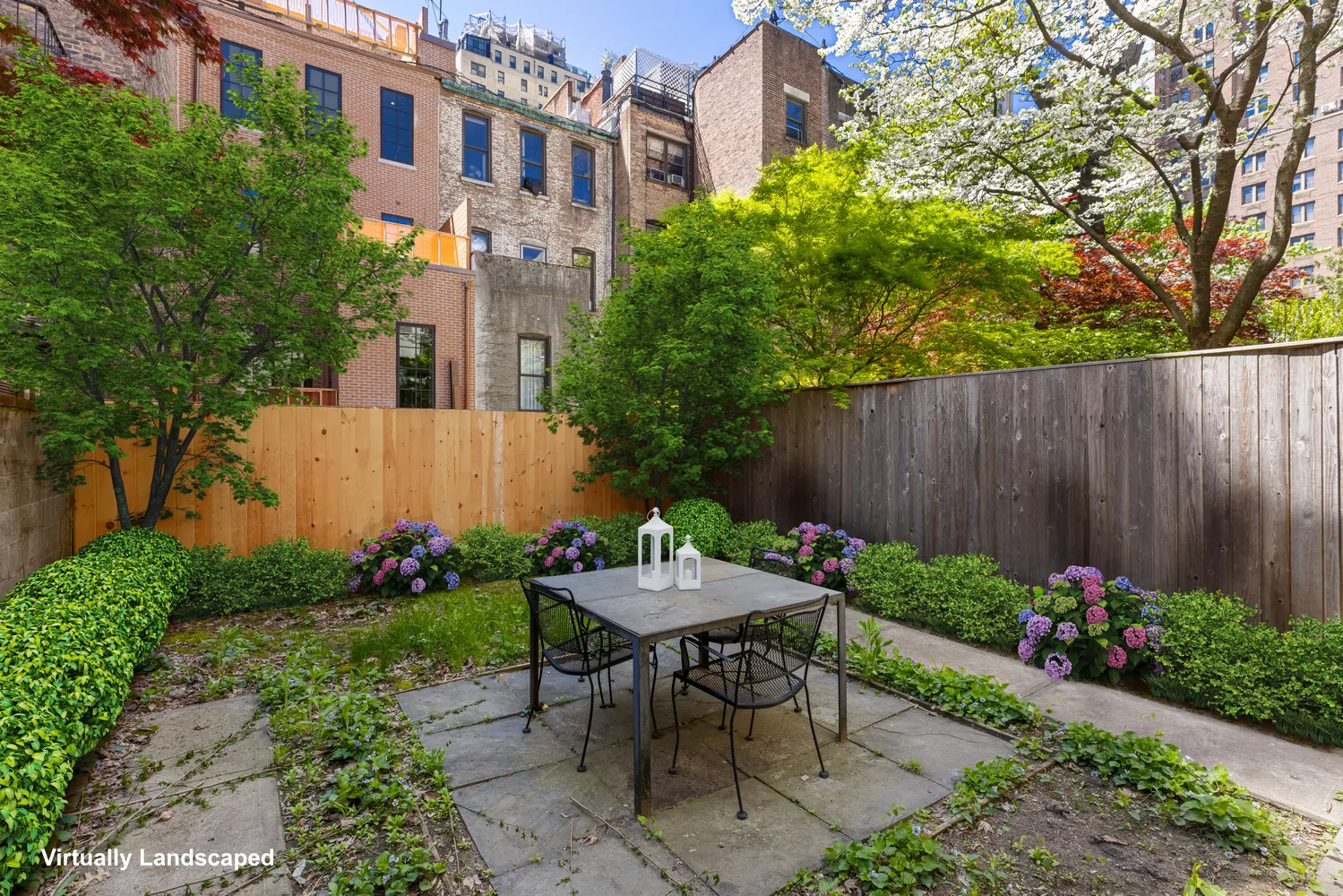 a view of a patio with table and chairs and potted plants