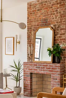 a bathroom with a potted plant and a sink