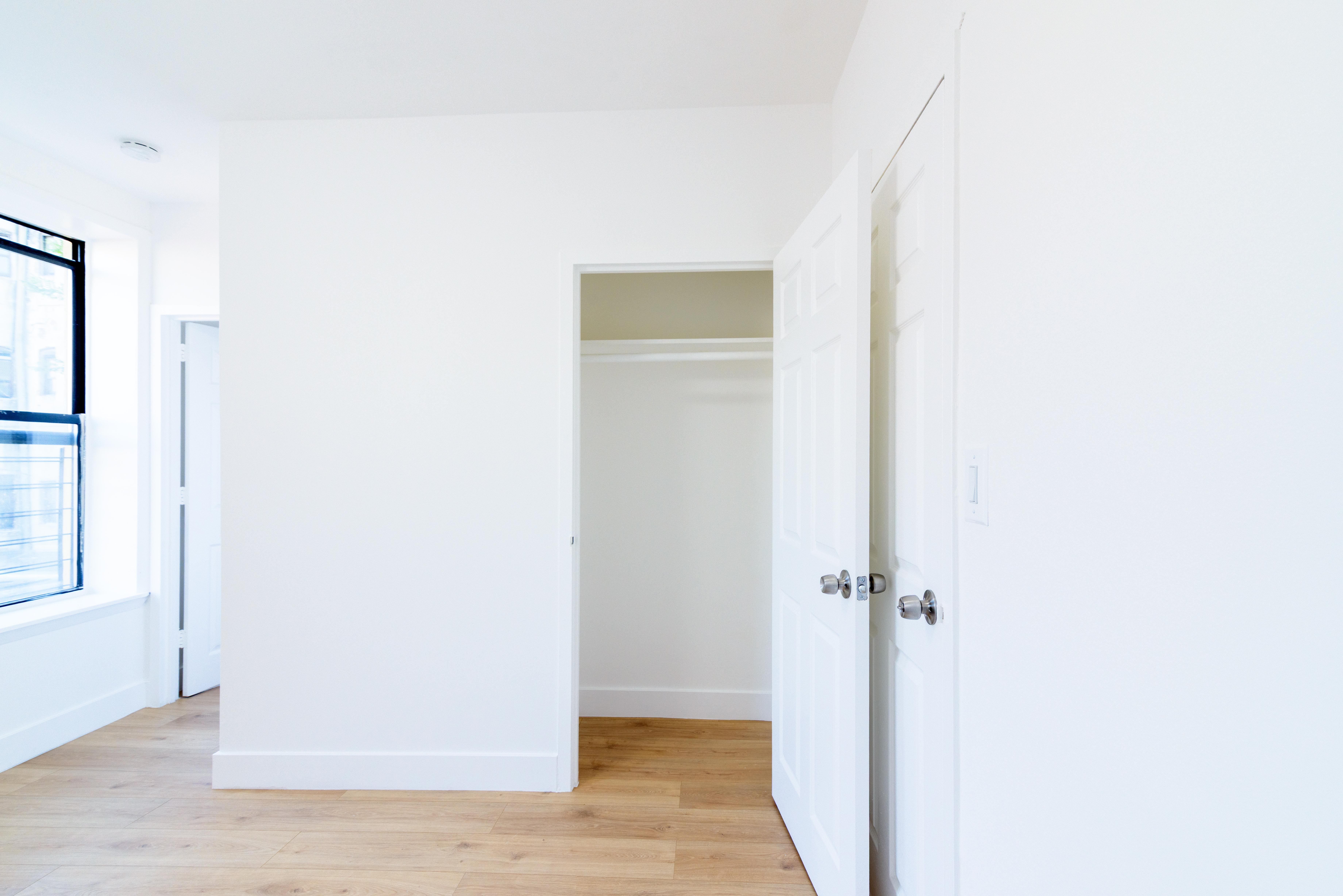 517 West 144th Street, Unit 9 Manhattan, NY 10031 - Photo 4 of 22 a view of a hallway with wooden floor