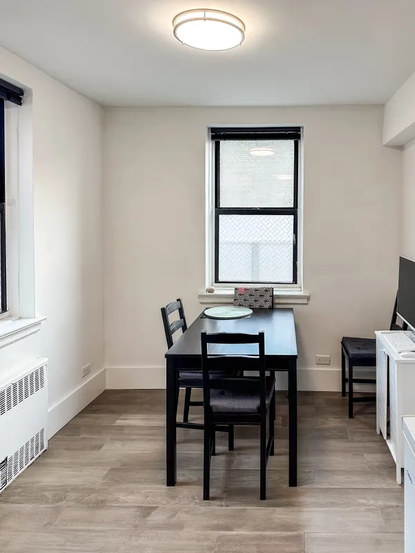 a view of a workspace with furniture