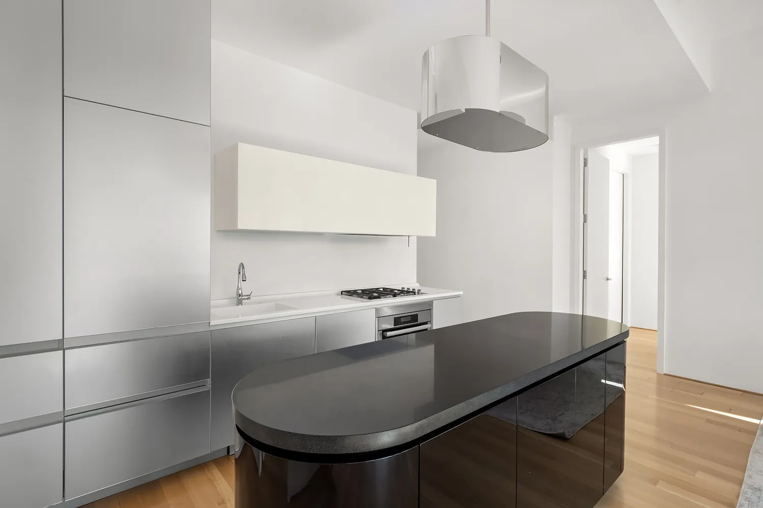 a kitchen with granite countertop a sink stainless steel appliances and cabinets