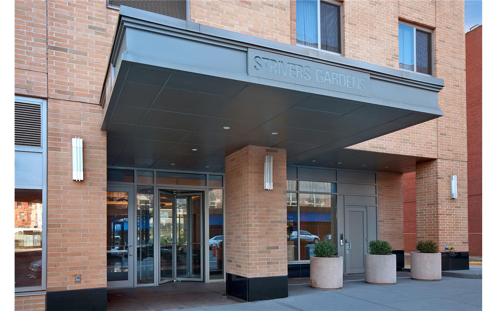 300 West 135th Street, Unit 12C Manhattan, NY 10030 - Photo 8 of 9 a view of building with glass door and outdoor space
