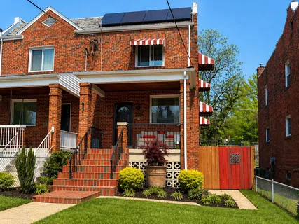 front view of a house with a yard