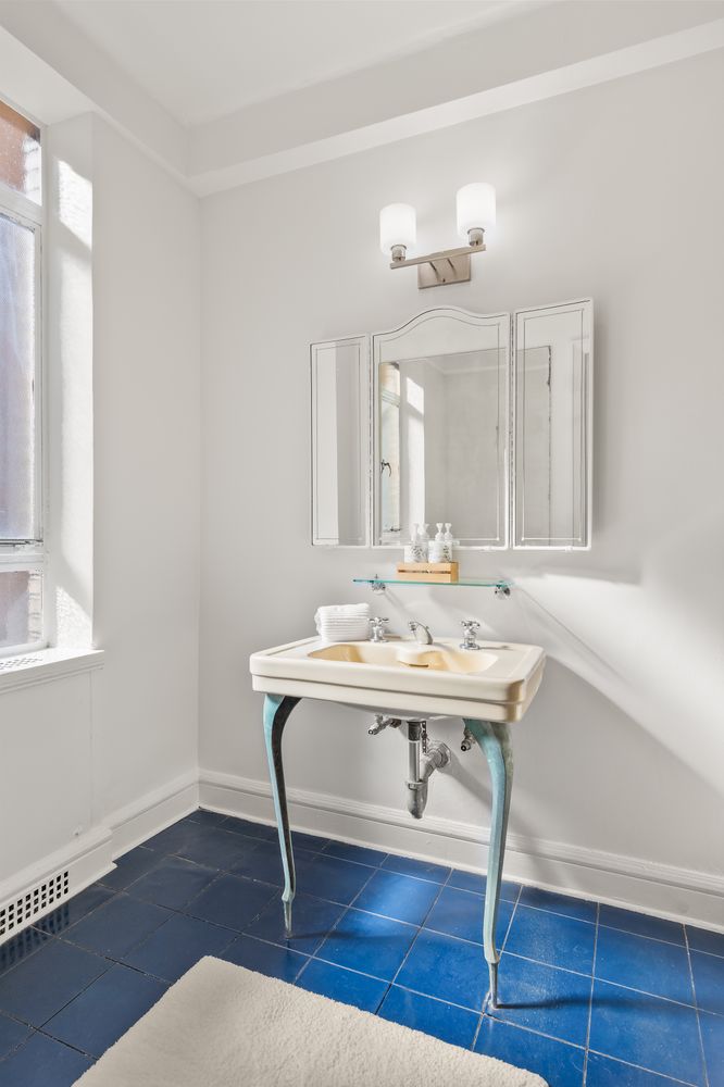 a view of a room that has a table and chairs