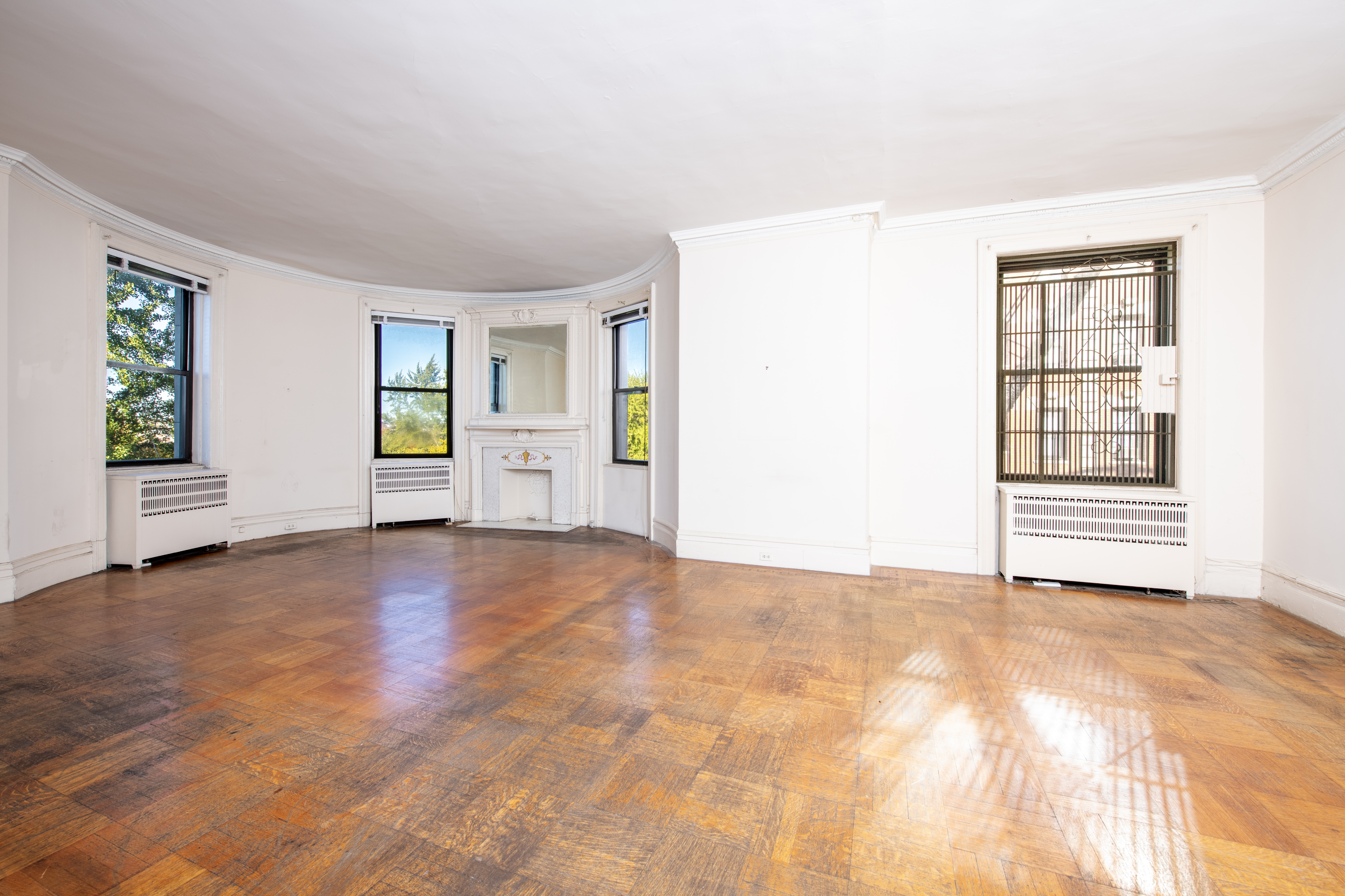 194 Riverside Drive, Unit 5E Manhattan, NY 10025 - Photo 2 of 26 a view of an empty room with a window and fire place