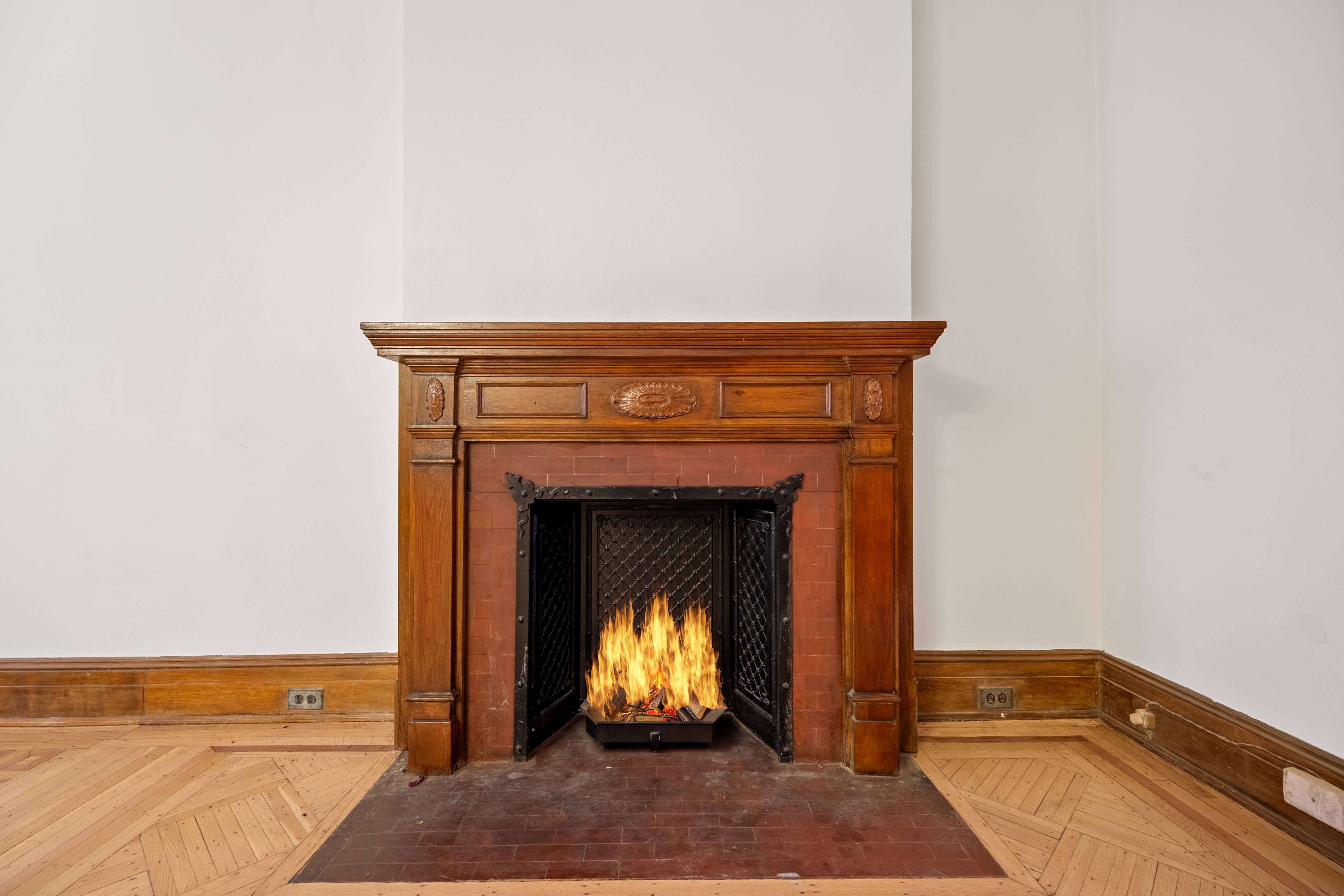 196 Maple Street Brooklyn, NY 11225 - Photo 26 of 31 a living room with a fireplace