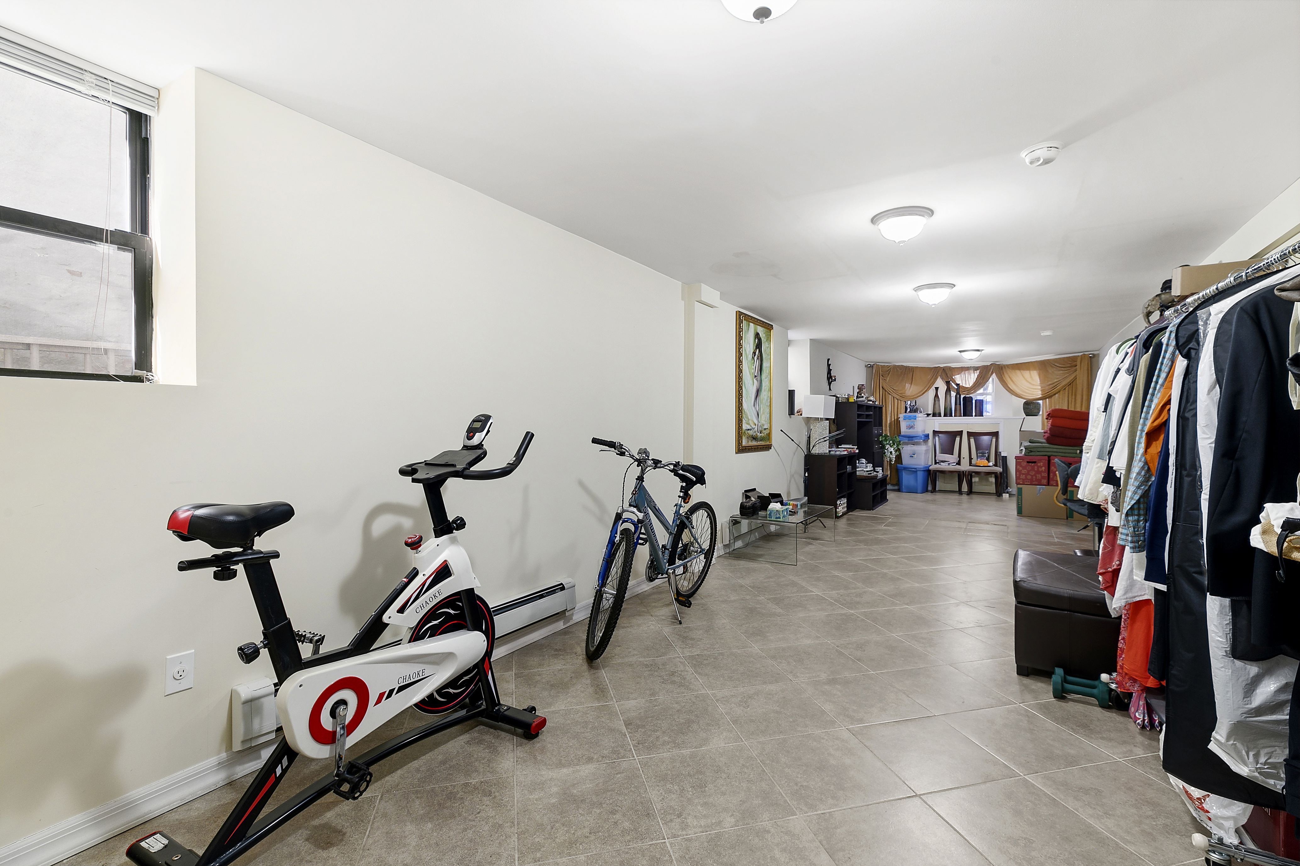 60-38 68th Road Queens, NY 11385 - Photo 12 of 14 a view of a room with gym equipment