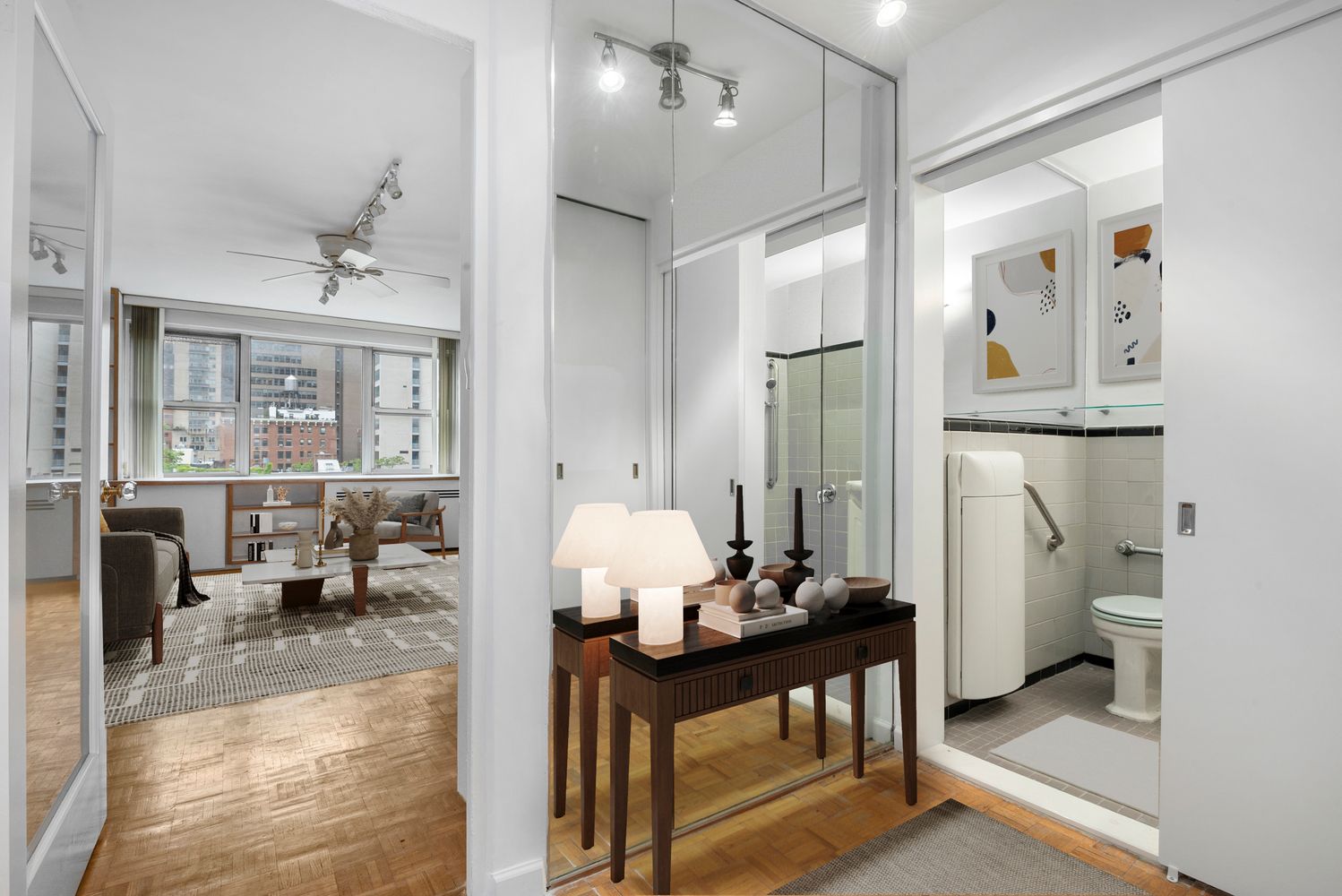 a living room with furniture and view of bathroom