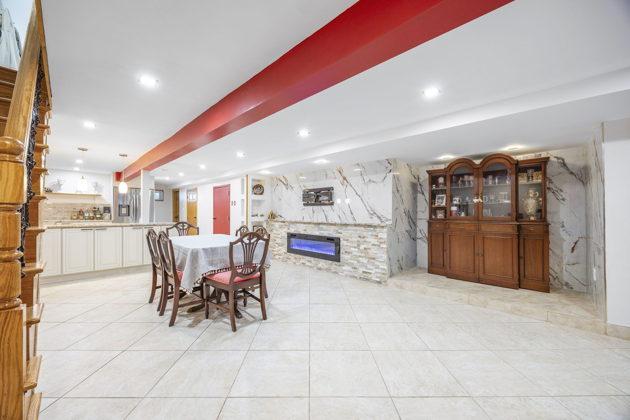 25-69 46th Street Queens, NY 11103 - Photo 26 of 33 a dining hall with stainless steel appliances a dining table and chairs with wooden floor