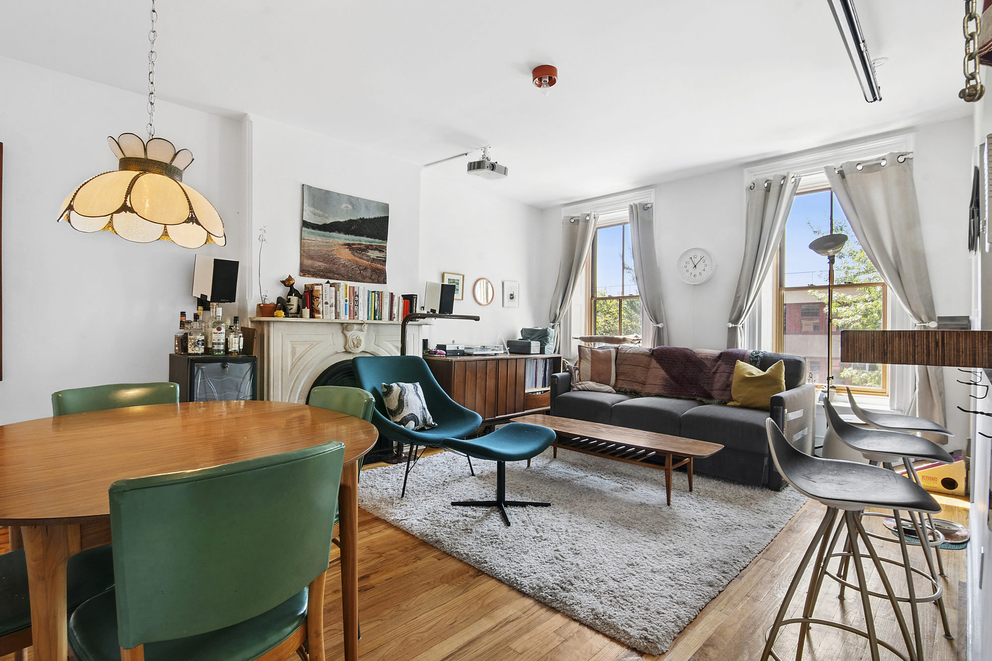 789 A Monroe Street, Unit 2 Brooklyn, NY 11221 - Photo 1 of 8 a living room with furniture fireplace and a large window