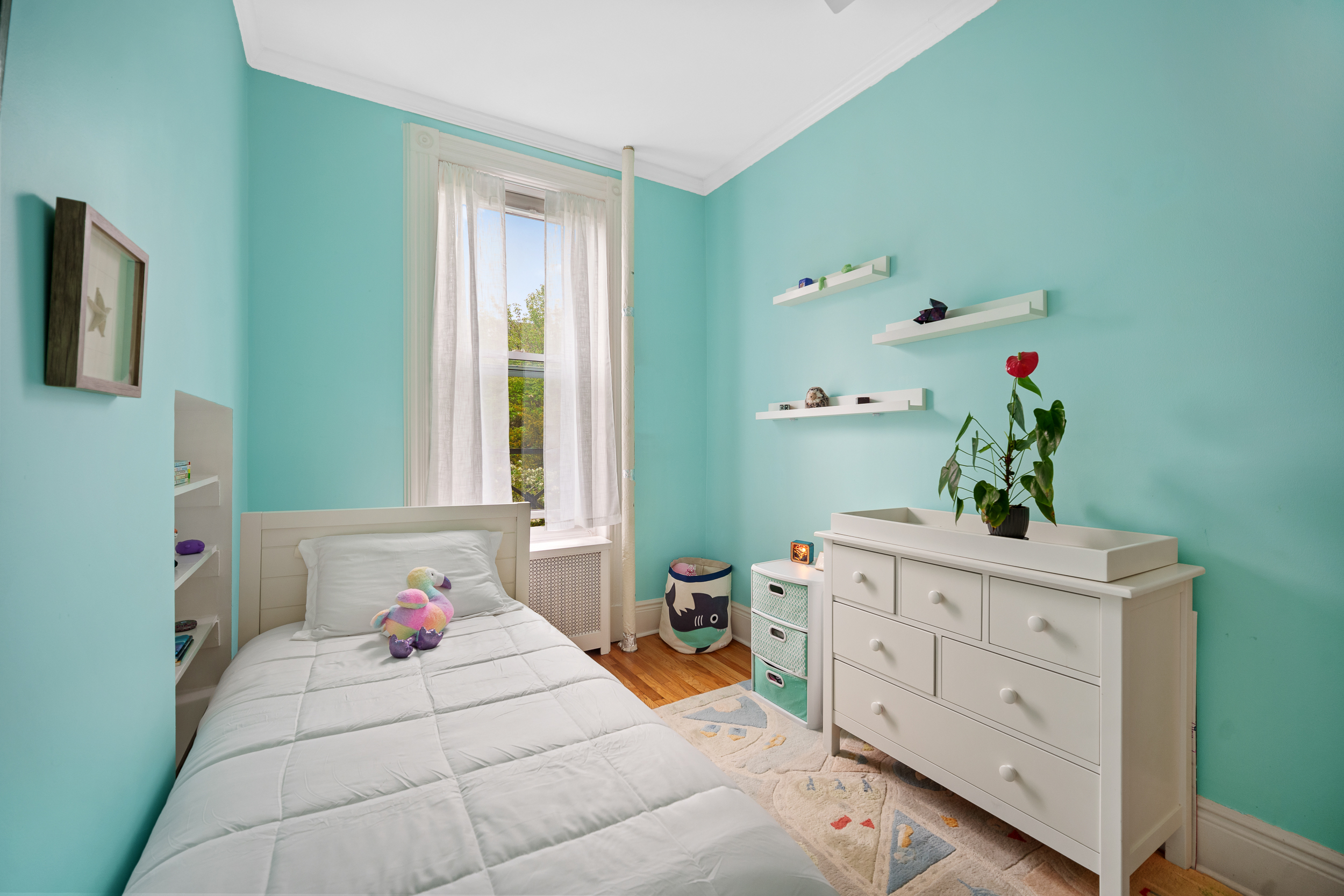 182 Saint Marks Avenue, Unit 2 Brooklyn, NY 11238 - Photo 9 of 14 a bedroom with a bed and a dresser