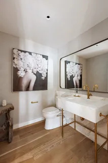a view of a hallway with entryway wooden floor and front door