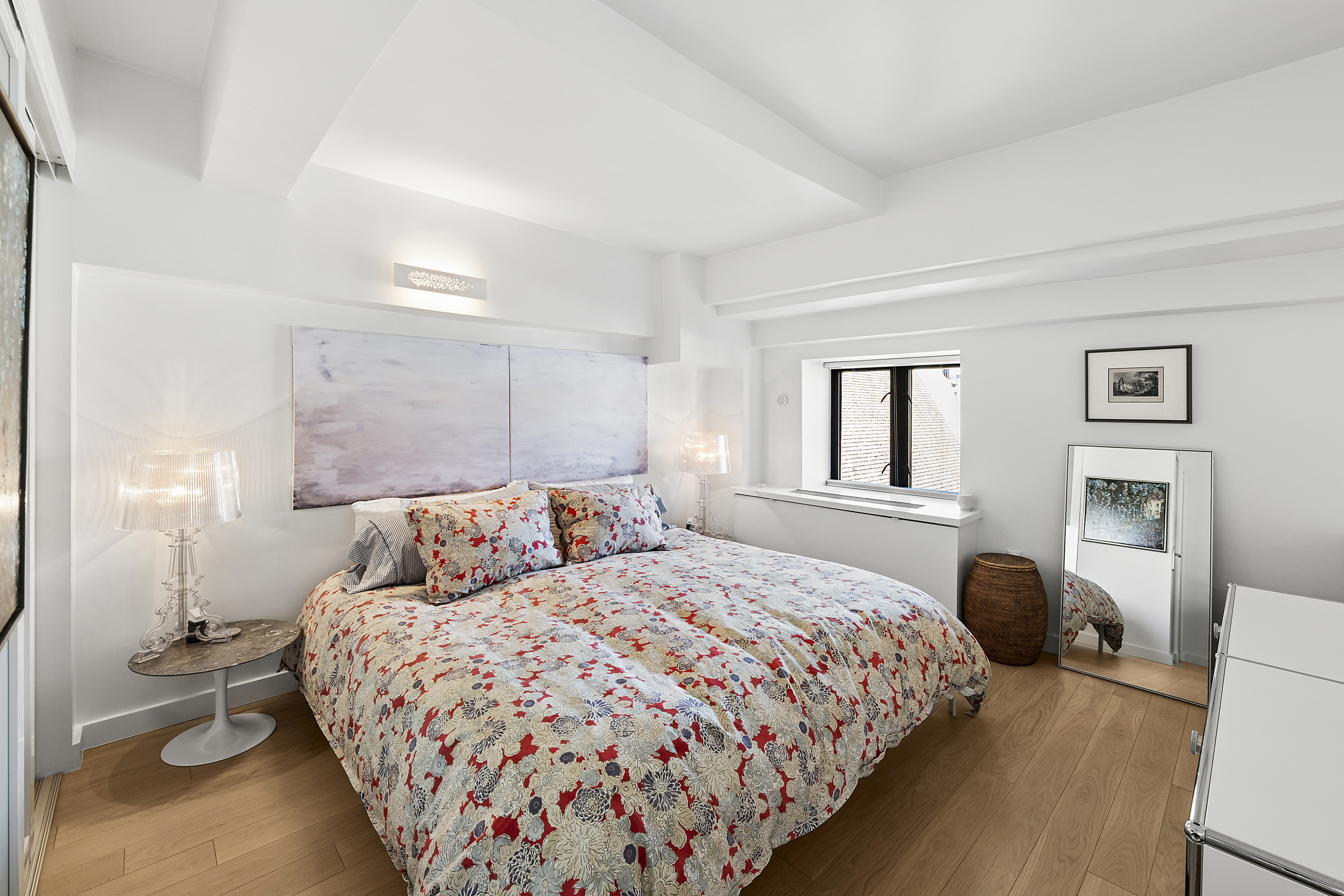 135 West 70th Street, Unit 8A Manhattan, NY 10023 - Photo 5 of 14 a bedroom with a bed and painting on the wall