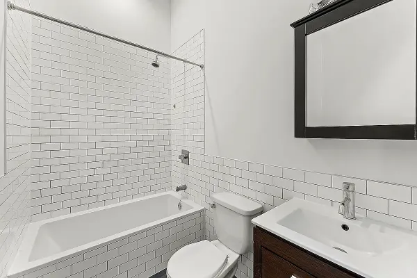 a bathroom with a sink toilet and bathtub
