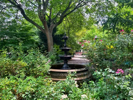 a view of a garden with sitting area