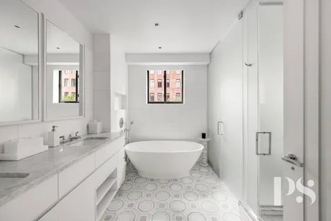 a spacious bathroom with a bathtub sink and toilet