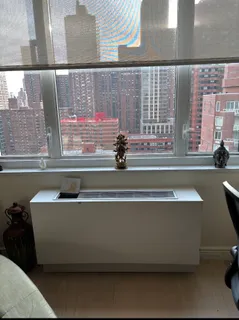 a kitchen with a stove sink and cabinets