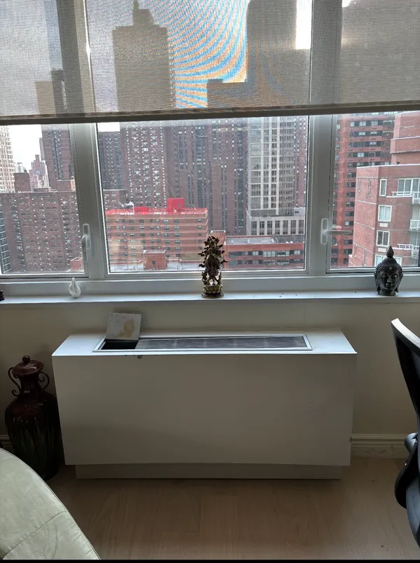 a kitchen with a stove sink and cabinets