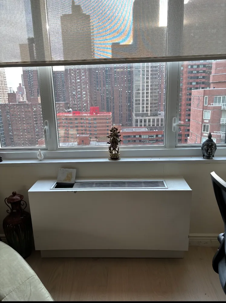 a kitchen with a stove sink and cabinets
