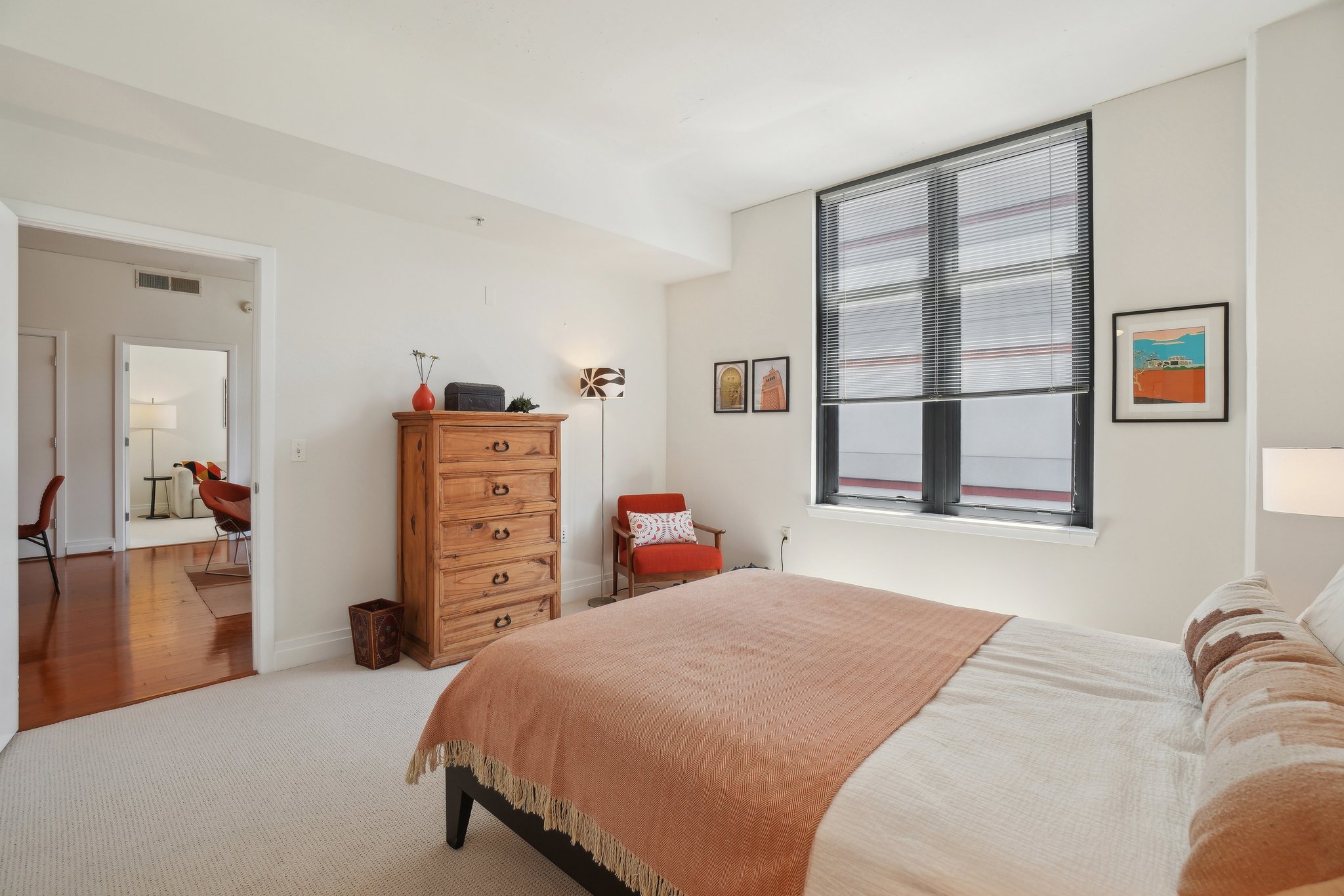 2120 Vermont Avenue Northwest, Unit 309 Washington, DC 20001 - Photo 12 of 26 a bedroom with a bed and a cabinets