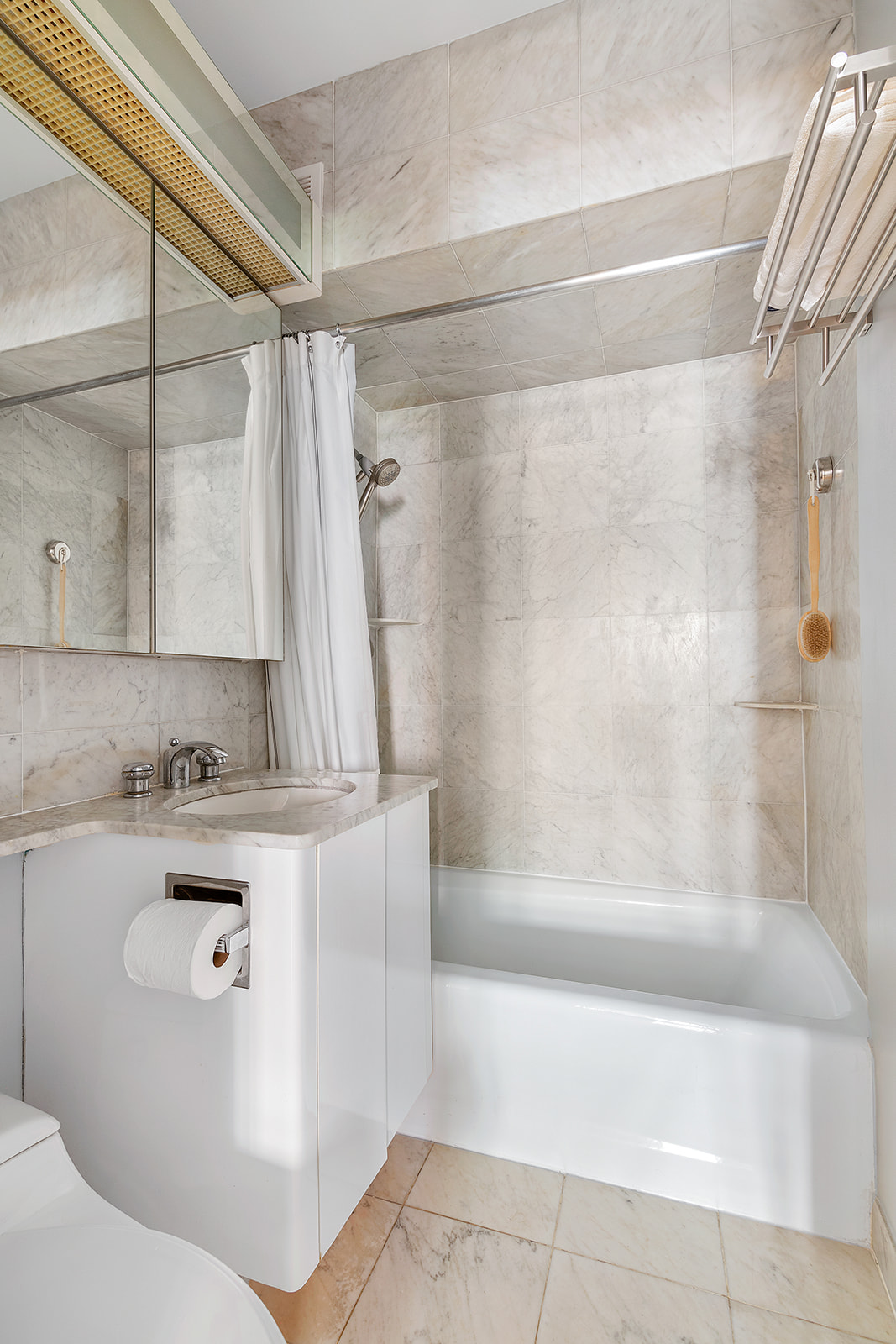 333 West 57th Street, Unit 8B Manhattan, NY 10019 - Photo 6 of 8 a bathroom with a bathtub and shower