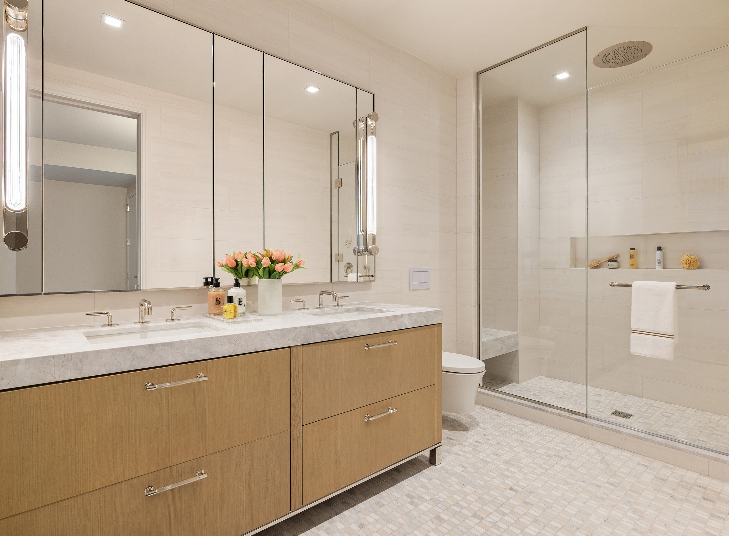 201 East 23rd Street, Unit 17A Manhattan, NY 10010 - Photo 4 of 20 a bathroom with a shower sink and mirror