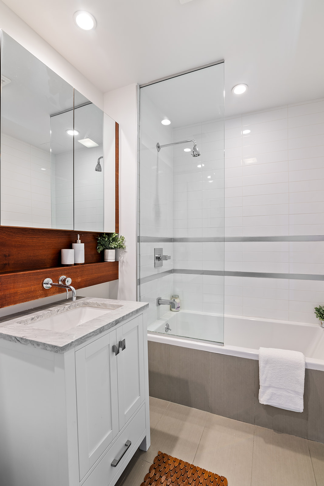 333 East 109th Street, Unit 7A Manhattan, NY 10029 - Photo 5 of 10 a bathroom with a sink double vanity and a bathtub