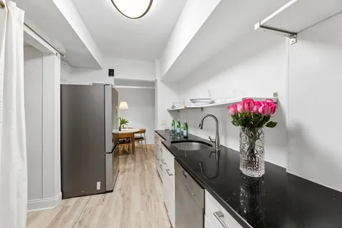 a view of living room with furniture and flower pot