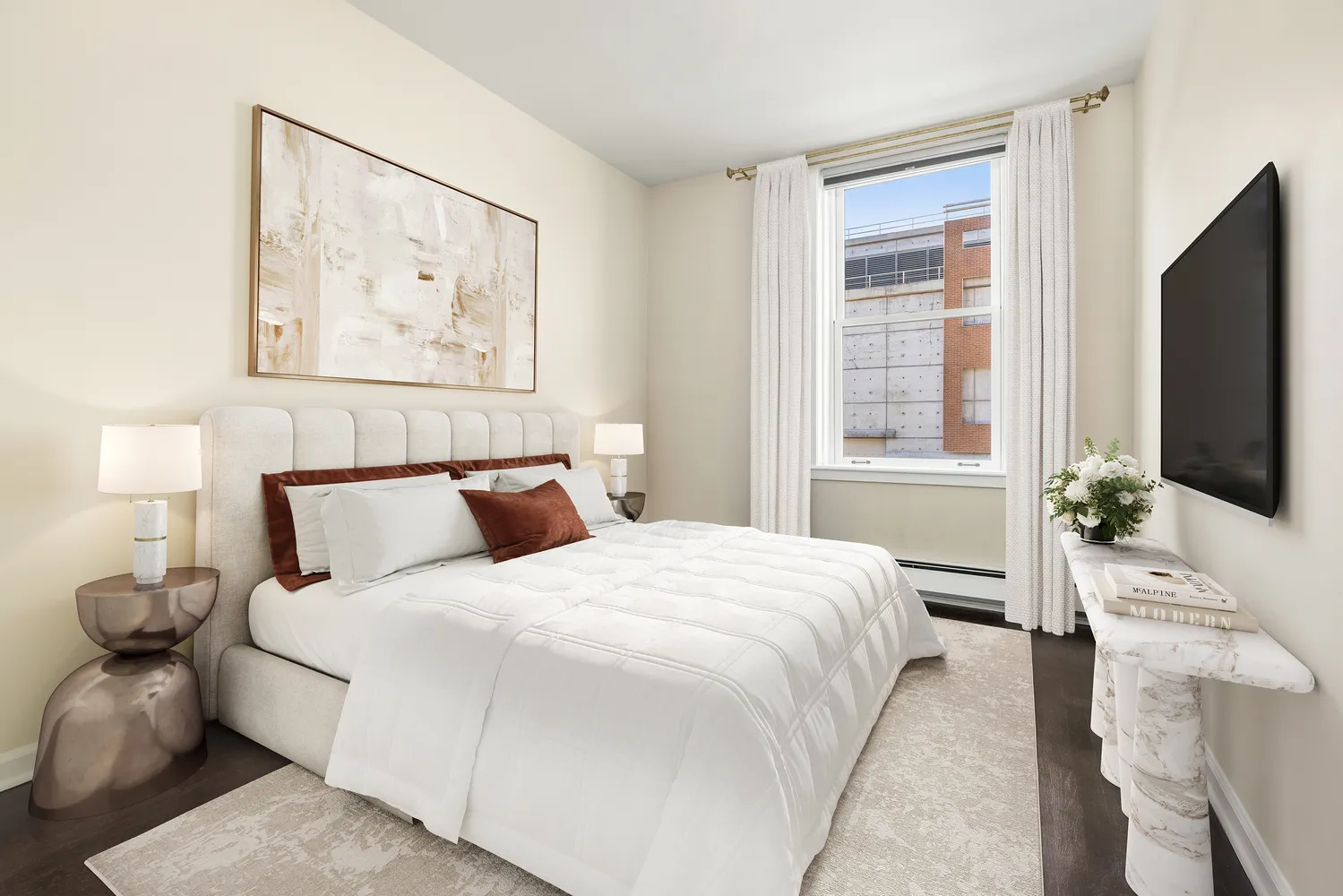 a bedroom with a bed and a flat screen tv