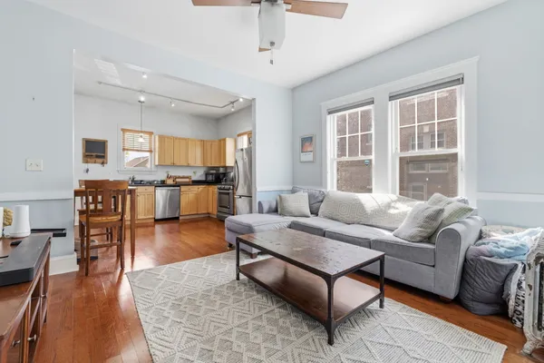 a living room with furniture and a table