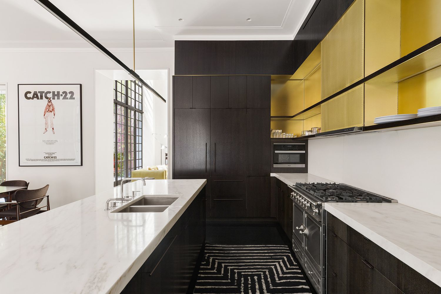 a kitchen with a sink stove and cabinets