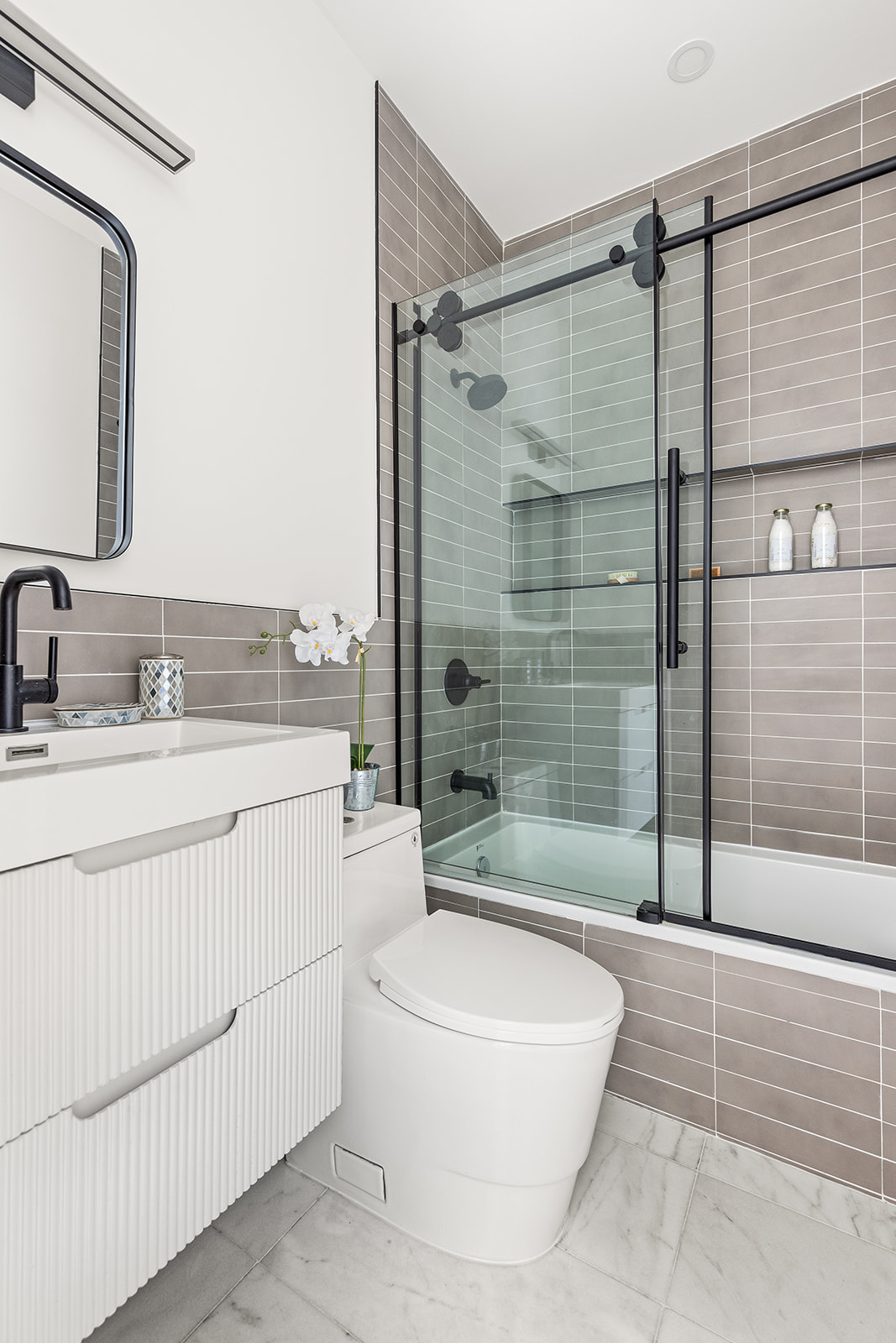 17 Linden Street Brooklyn, NY 11221 - Photo 11 of 19 a bathroom with a sink a toilet and shower