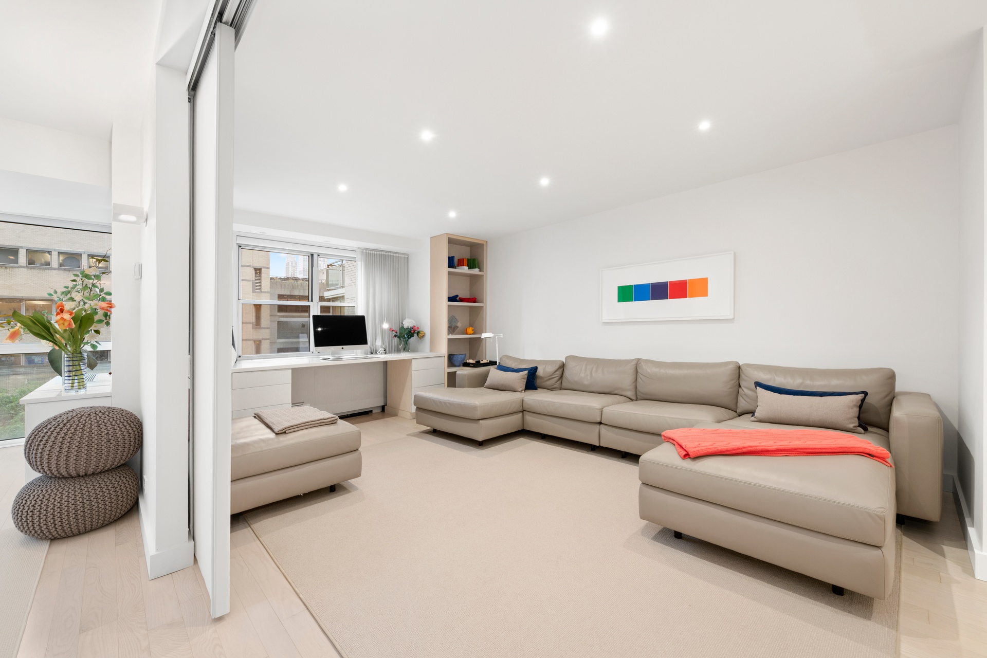 150 East 69th Street, Unit 7K Manhattan, NY 10021 - Photo 6 of 22 a living room with furniture and a large window