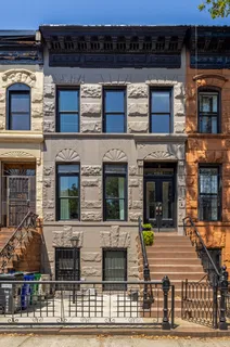 front view of a building with a balcony