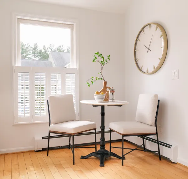 a view of a livingroom with furniture window and wooden floor