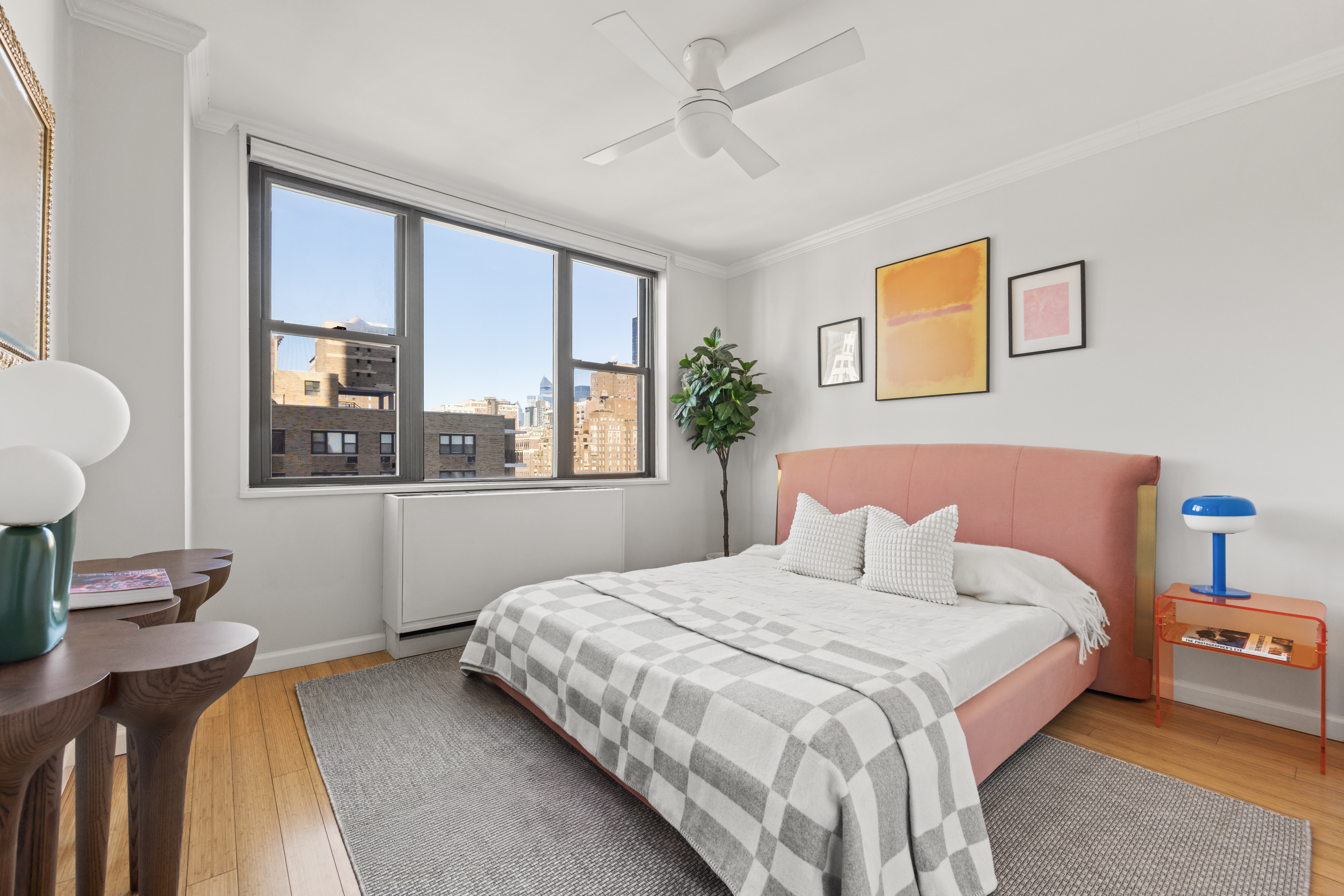 201 East 17th Street, Unit 14F Manhattan, NY 10003 - Photo 6 of 9 a bedroom with a large bed and a window