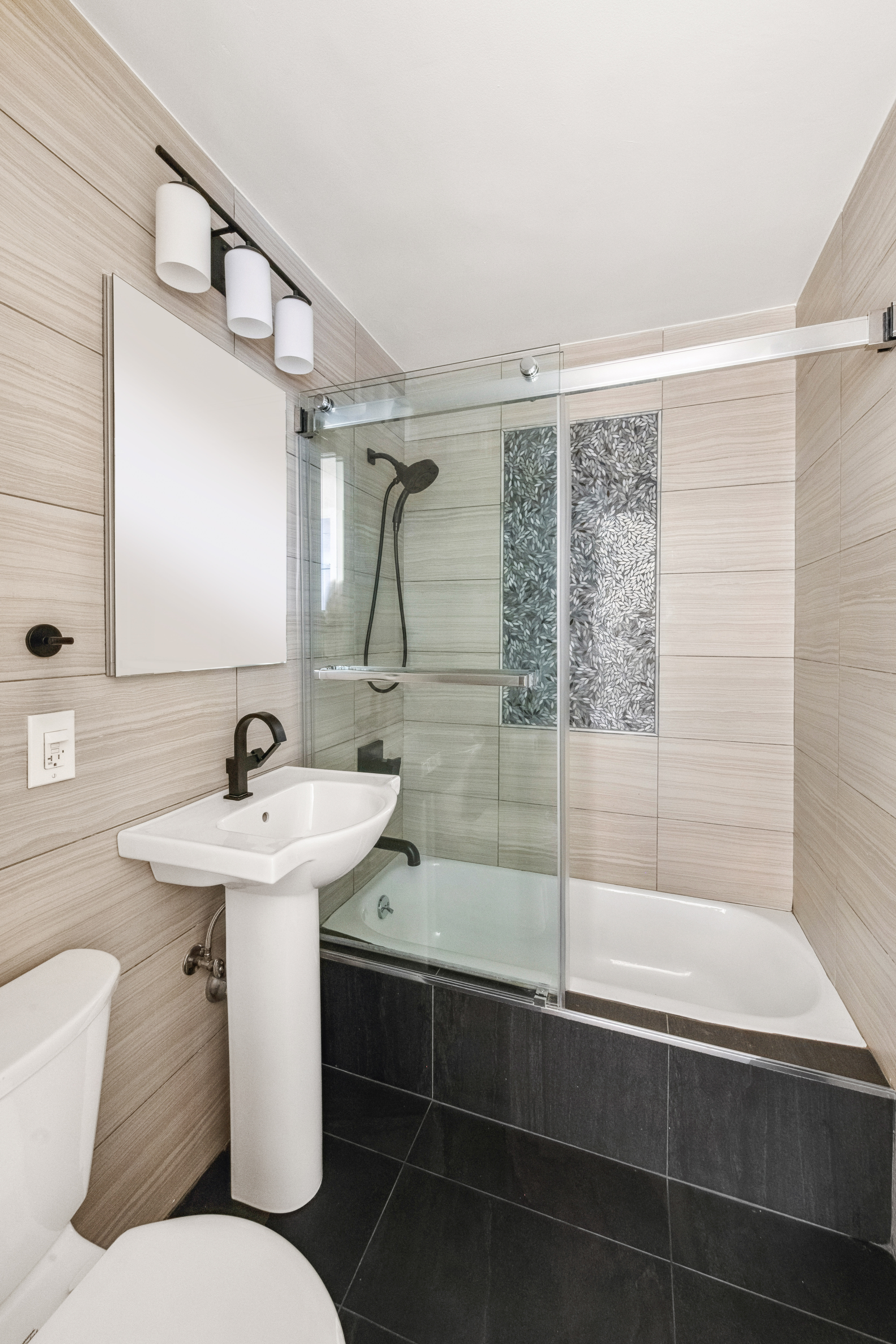 340 East 80th Street, Unit 1D Manhattan, NY 10075 - Photo 10 of 15 a bathroom with a sink toilet and shower