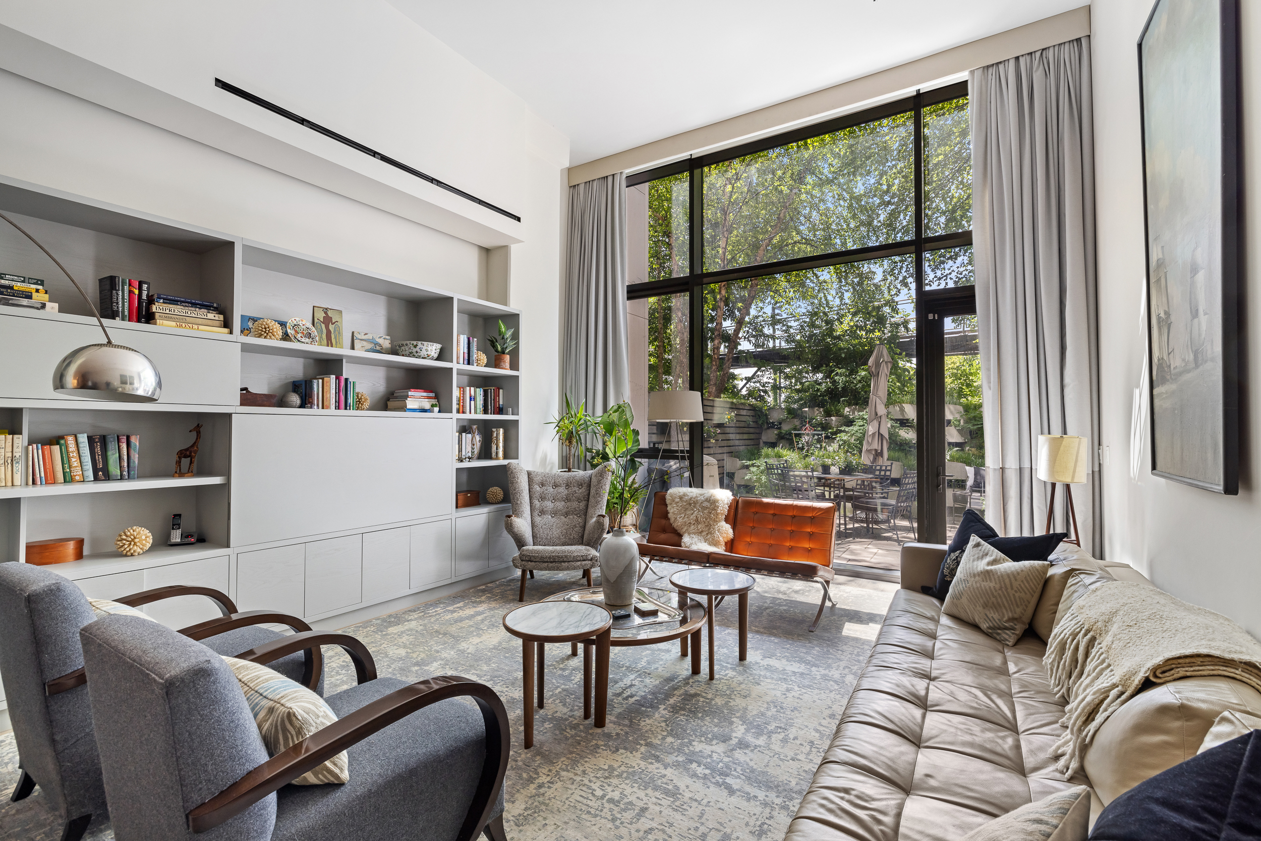 90 Furman Street, Unit N107 Brooklyn, NY 11201 - Photo 1 of 30 a living room with furniture and a window