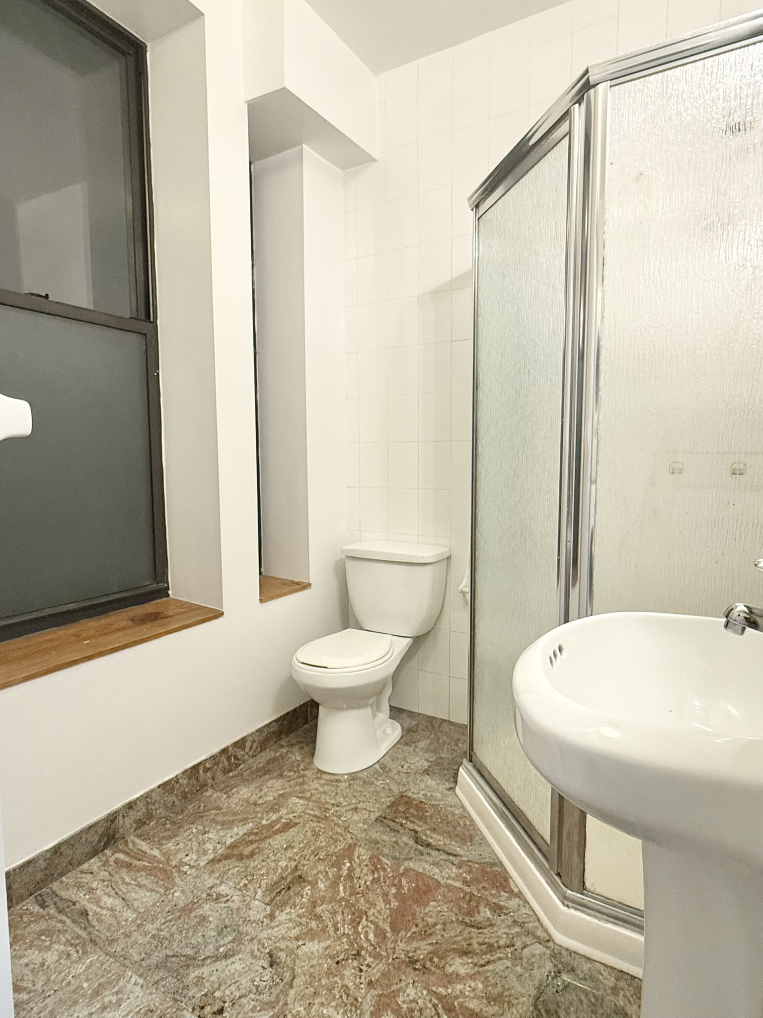 839 West End Avenue, Unit 3D Manhattan, NY 10025 - Photo 7 of 10 a bathroom with a sink and a toilet